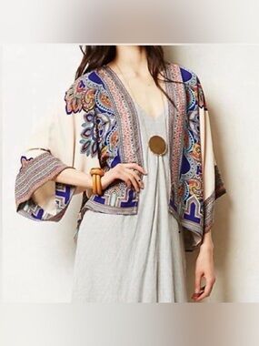ASOS kimono features a cream-colored base with a vibrant blue